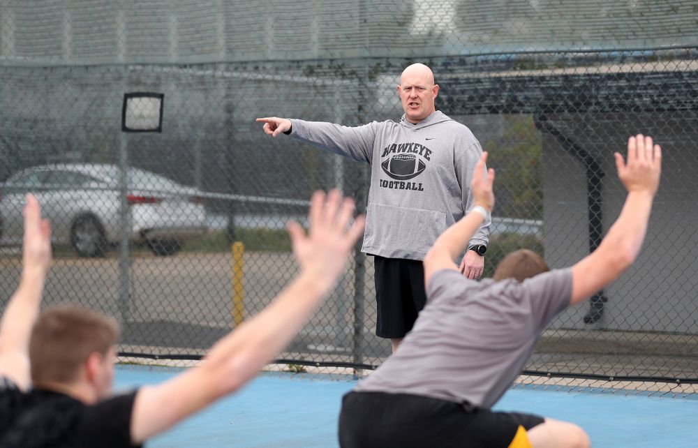 Iowa Hawkeyes strength and conditioning coordinator Chris Doyle warms up a lift group before practice Sunday, December 22, 2019 at Mesa College in San Diego. (Brian Ray/hawkeyesports.com)