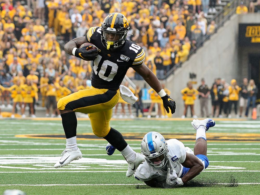 Iowa Hawkeyes running back Mekhi Sargent (10) pulls away from a tackle during the second quarter of their game at Kinnick Stadium in Iowa City on Saturday, Sep 28, 2019. (Stephen Mally/hawkeyesports.com)