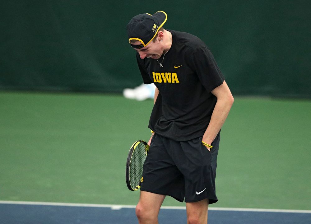 Iowa’s Nikita Snezhko celebrates a point during his doubles match at the Hawkeye Tennis and Recreation Complex in Iowa City on Friday, March 6, 2020. (Stephen Mally/hawkeyesports.com)