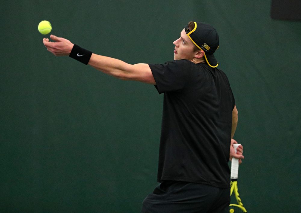 Iowa’s Joe Tyler serves during his singles match at the Hawkeye Tennis and Recreation Complex in Iowa City on Friday, March 6, 2020. (Stephen Mally/hawkeyesports.com)