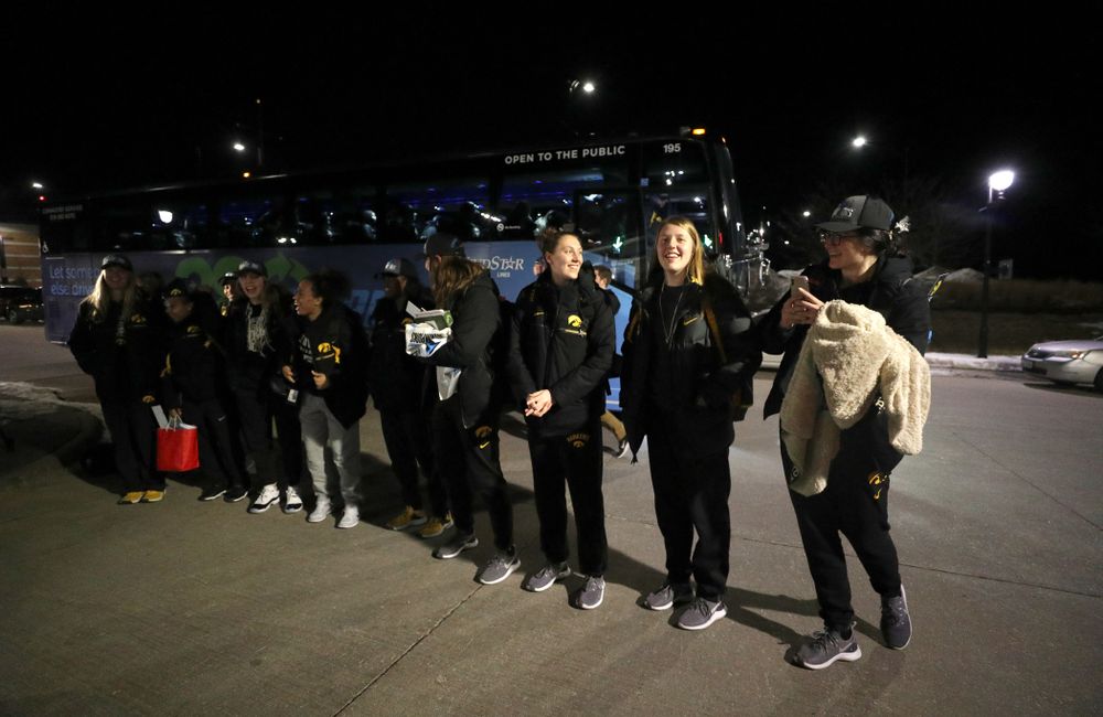The Iowa Hawkeyes celebrates= with fans as they arrive back in Coralville after defeating the Maryland Terrapins in the Big Ten Championship Game Sunday, March 10, 2019 in Indianapolis, Ind. (Brian Ray/hawkeyesports.com)
