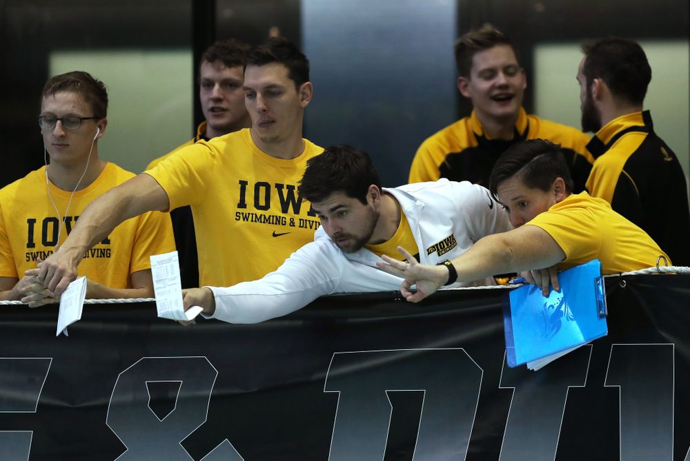 Iowa Hawkeye assistant coaches Sarah Stockwell-Gregson and Richard Salhus Thursday, November 15, 2018 during the 2018 Hawkeye Invitational at the Campus Recreation and Wellness Center. (Brian Ray/hawkeyesports.com)