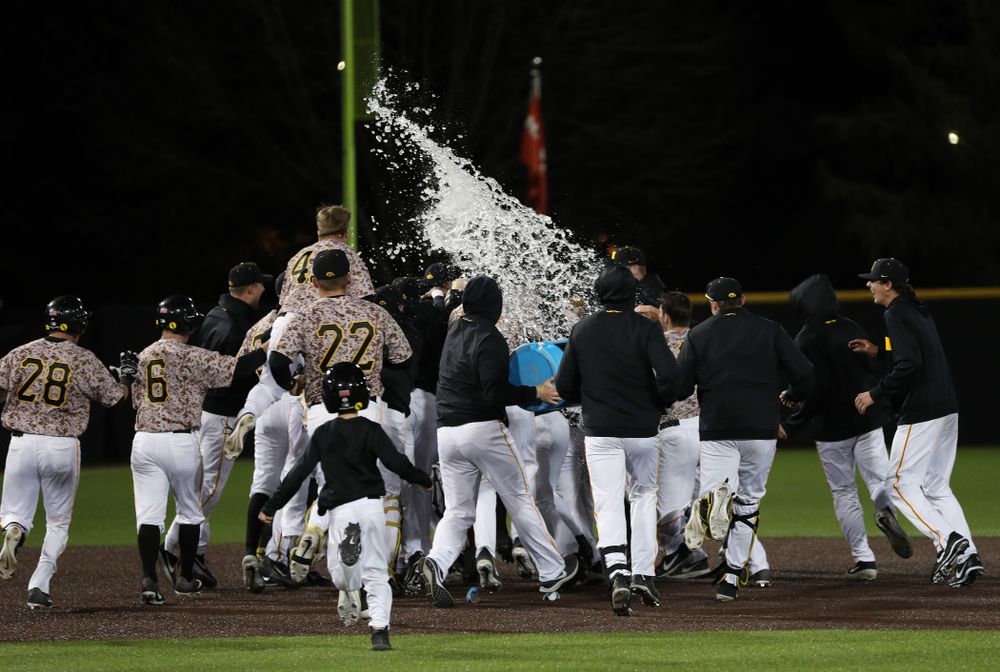 The Iowa Hawkeyes celebrate their walk off win against the Nebraska Cornhuskers on Military Appreciation Night Friday, April 19, 2019 at Duane Banks Field. (Brian Ray/hawkeyesports.com)