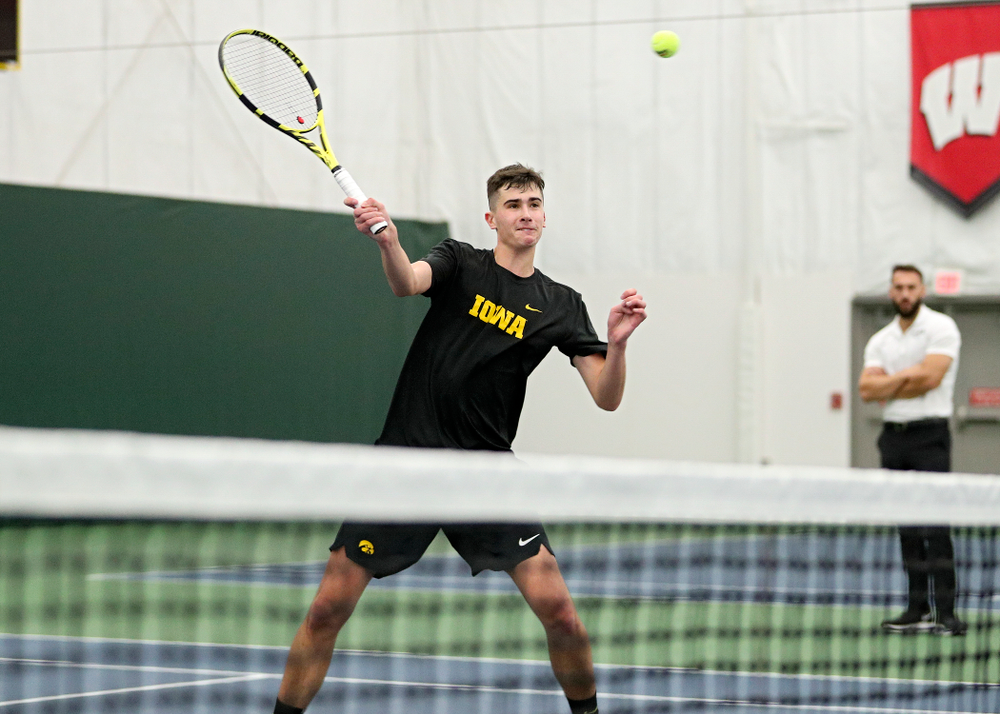 Iowa’s Matt Clegg returns a shot during his doubles match at the Hawkeye Tennis and Recreation Complex in Iowa City on Thursday, January 16, 2020. (Stephen Mally/hawkeyesports.com)
