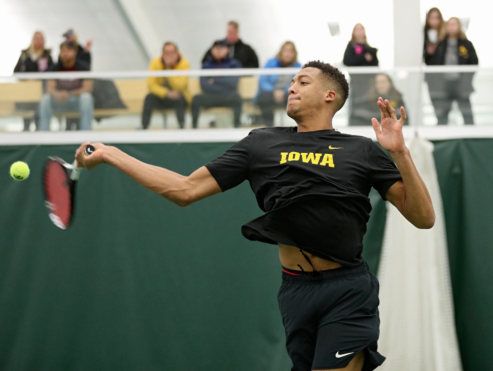 Iowa’s Oliver Okonkwo returns a shot during his doubles match at the Hawkeye Tennis and Recreation Complex in Iowa City on Thursday, January 16, 2020. (Stephen Mally/hawkeyesports.com)
