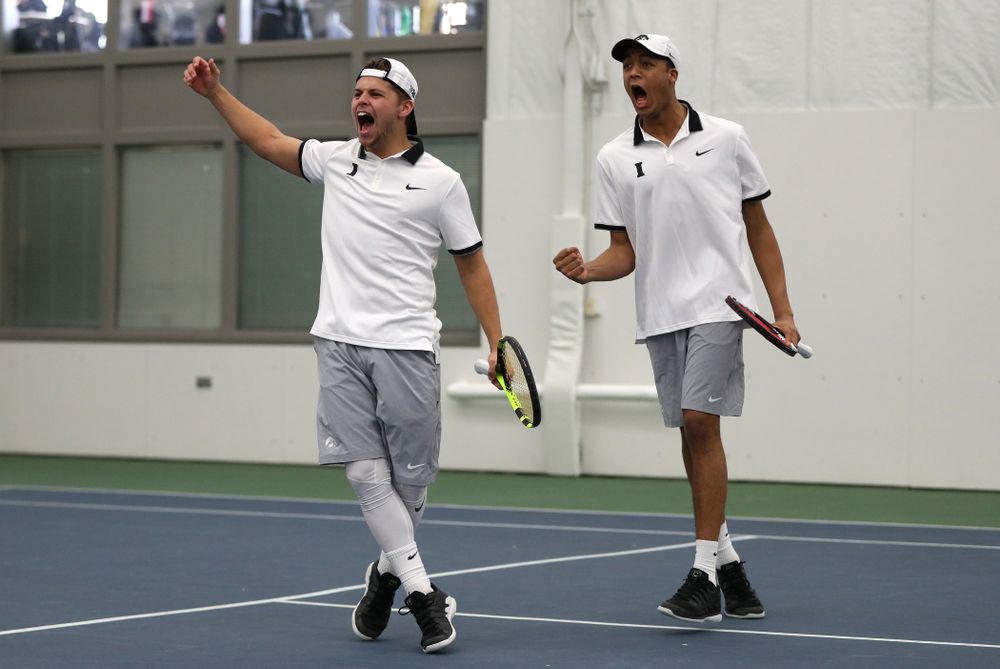 Iowa's Will Davies and Oliver Okonkwo celebrate after winning a doubles match against Western Michigan Saturday, January 19, 2019 at the Hawkeye Tennis and Recreation Complex. (Brian Ray/hawkeyesports.com)