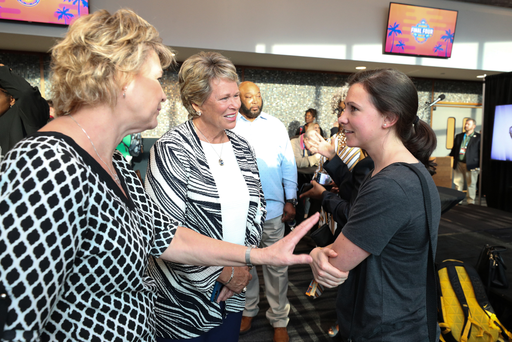 Iowa Hawkeyes head coach Lisa Bluder and director of basketball operations Kathryn Reynolds talk with Ann Meyers Drysdale following a news conference Thursday, April 4, 2019 at Amalie Arena in Tampa, FL. (Brian Ray/hawkeyesports.com)