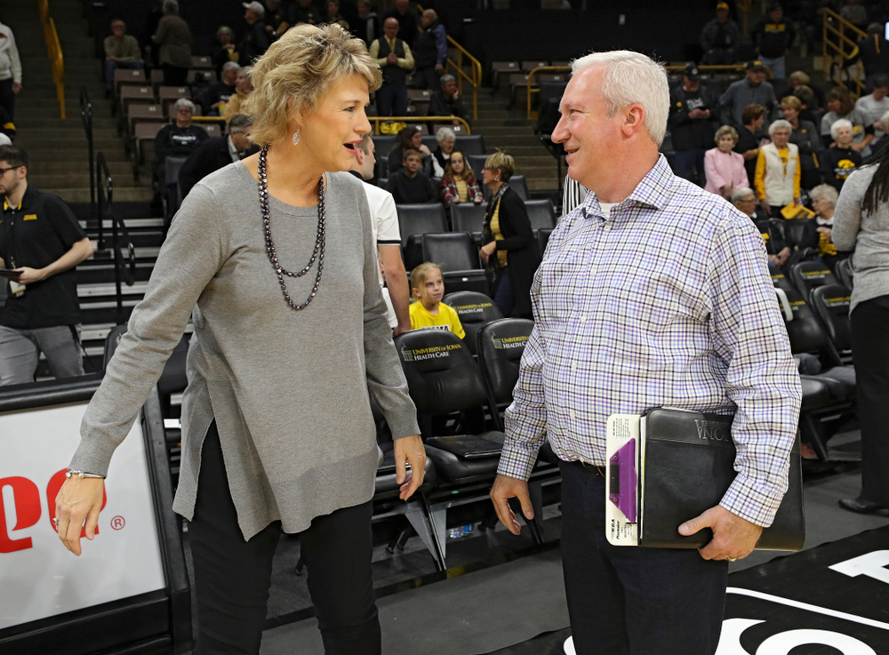 Iowa head coach Lisa Bluder talks with Winona State head coach Scott Ballard before their game against Winona State at Carver-Hawkeye Arena in Iowa City on Sunday, Nov 3, 2019. (Stephen Mally/hawkeyesports.com)