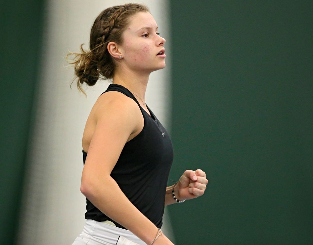 Iowa's Cloe Ruette pumps her fist as she celebrates a point during their doubles match against Indiana at the Hawkeye Tennis and Recreation Complex in Iowa City on Sunday, Mar. 31, 2019. (Stephen Mally/hawkeyesports.com)