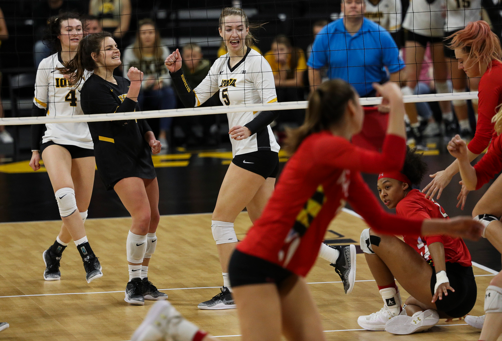Iowa Hawkeyes defensive specialist Molly Kelly (1) and Iowa Hawkeyes outside hitter Meghan Buzzerio (5) celebrate after winning a point during a match against Maryland at Carver-Hawkeye Arena on November 23, 2018. (Tork Mason/hawkeyesports.com)