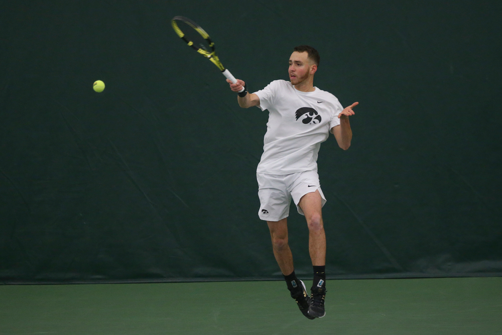 Iowa’s Kareem Allaf returns a hit during the Iowa men’s tennis meet vs Nebraska on Sunday, March 1, 2020 at the Hawkeye Tennis and Recreation Complex. (Lily Smith/hawkeyesports.com)