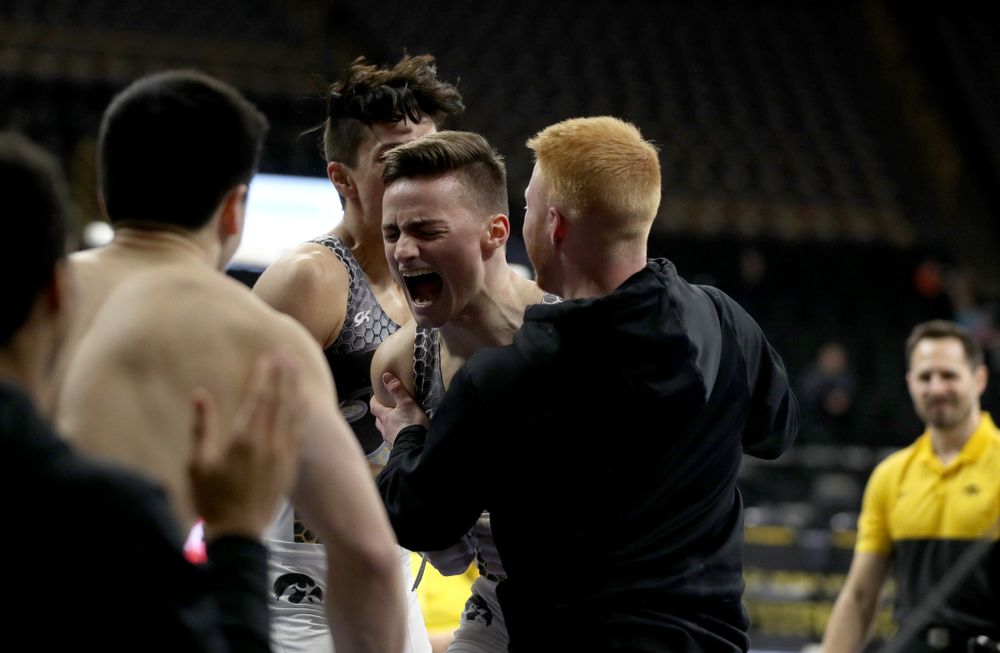 Iowa’s Mitch Mandozzi competes on the high bar against Illinois Sunday, March 1, 2020 at Carver-Hawkeye Arena. (Brian Ray/hawkeyesports.com)