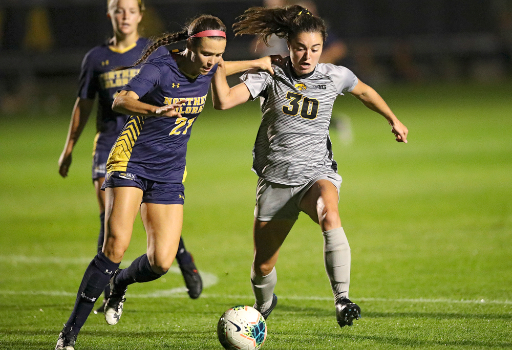 Iowa forward Devin Burns (30) battles for position on the ball during the second half of their match at the Iowa Soccer Complex in Iowa City on Friday, Sep 13, 2019. (Stephen Mally/hawkeyesports.com)