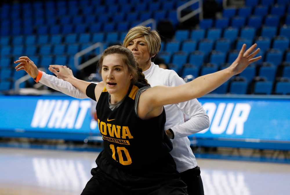 Iowa Hawkeyes forward Megan Gustafson (10) works against associate head coach Jan Jensen during practice Friday, March 16, 2018 at Pauley Pavilion on the campus of UCLA. (Brian Ray/hawkeyesports.com)