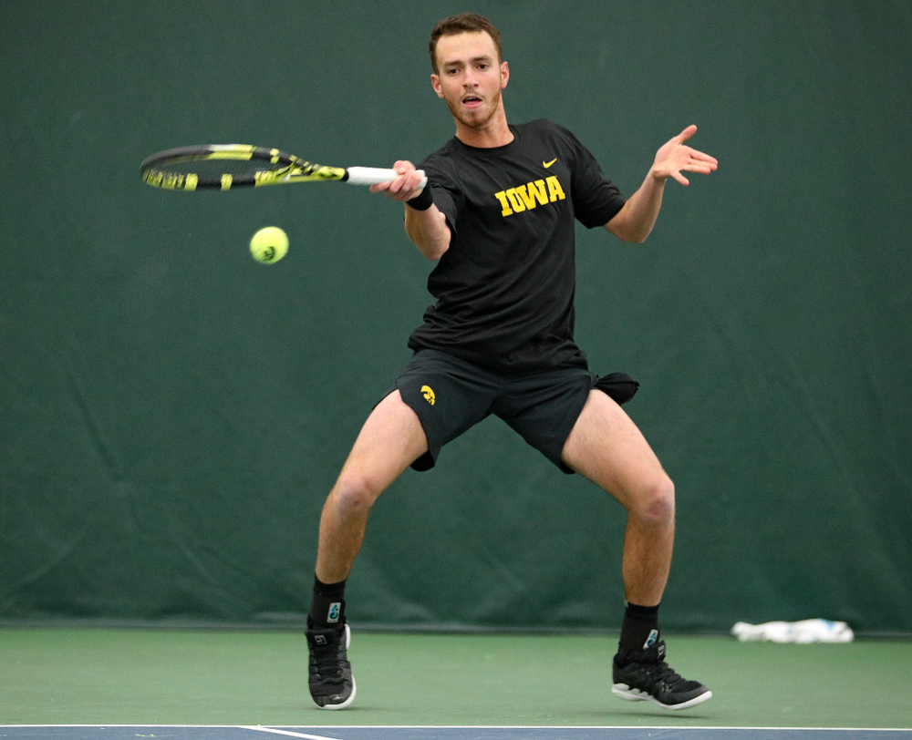 Iowa’s Kareem Allaf hits a shot during his match against Marquette at the Hawkeye Tennis and Recreation Complex in Iowa City on Saturday, January 25, 2020. (Stephen Mally/hawkeyesports.com)