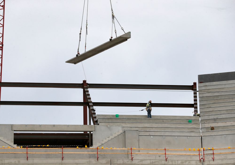 A section of precast concrete is lifted into place on the third deck of the north end zone Wednesday, June 6, 2018 at Kinnick Stadium. (Brian Ray/hawkeyesports.com)