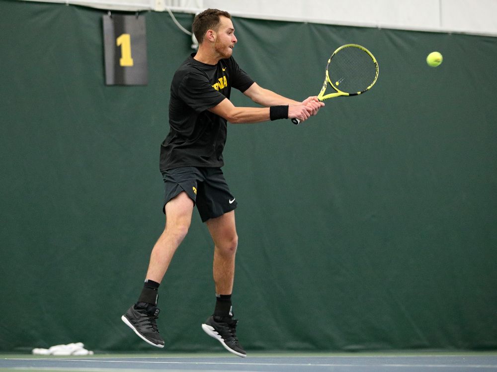 Iowa’s Kareem Allaf hits a shot during his match against Marquette at the Hawkeye Tennis and Recreation Complex in Iowa City on Saturday, January 25, 2020. (Stephen Mally/hawkeyesports.com)