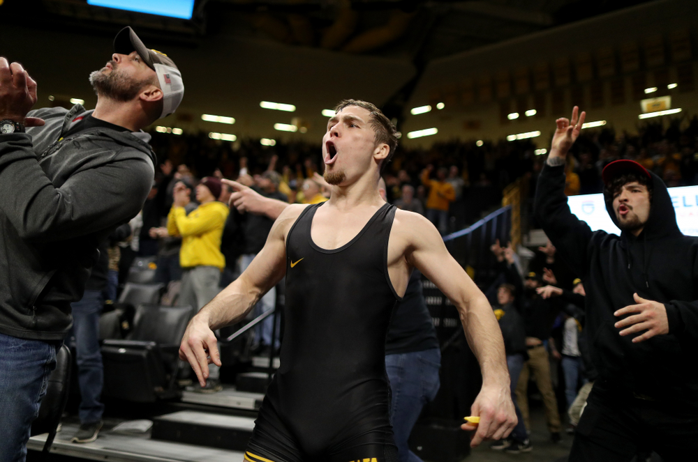 IowaÕs Spencer Lee cheers on teammate Austin DeSanto as he wrestles WisconsinÕs Seth Gross at 133 pounds Sunday, December 1, 2019 at Carver-Hawkeye Arena. DeSanto won the match 6-2. (Brian Ray/hawkeyesports.com)