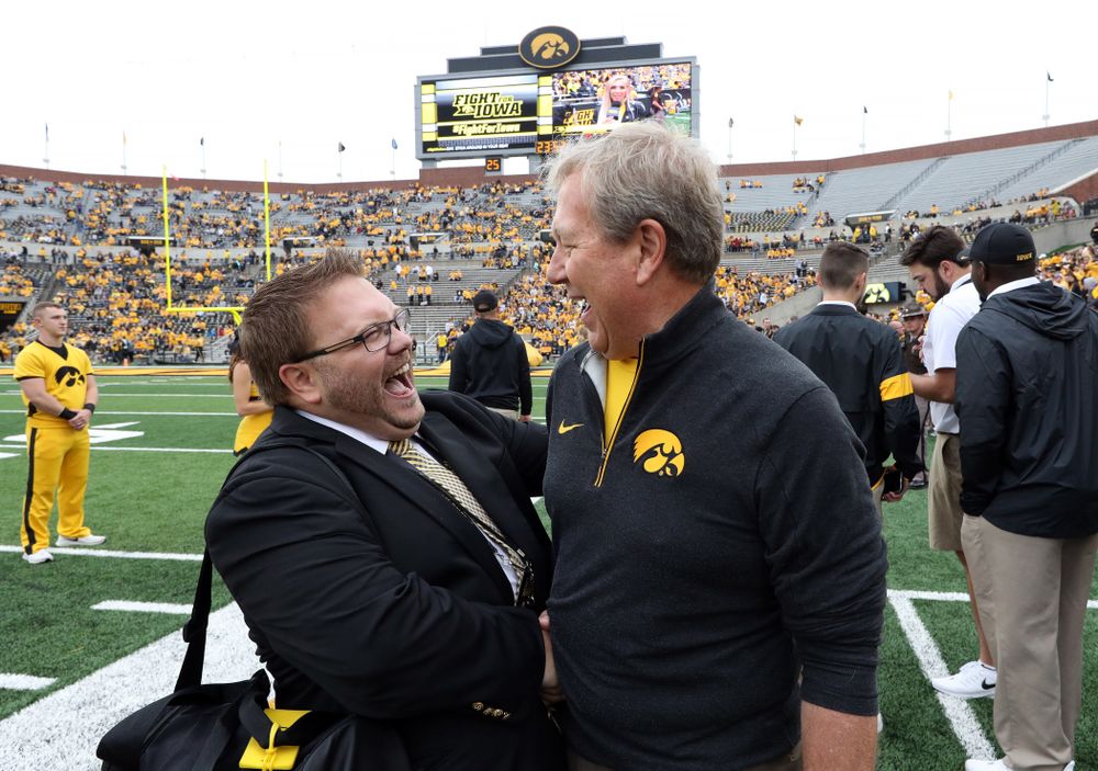 University of Iowa President Bruce Harreld talks with Hawkeye Marching Band Director Eric Bush before the Iowa Hawkeyes game against Middle Tennessee State Saturday, September 28, 2019 at Kinnick Stadium. (Brian Ray/hawkeyesports.com)