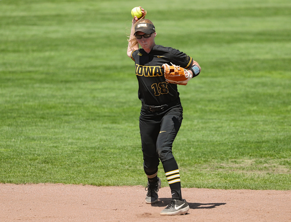 Iowa shortstop Ashley Hamilton (18) throws to first during the third inning of their game against Ohio State at Pearl Field in Iowa City on Saturday, May. 4, 2019. (Stephen Mally/hawkeyesports.com)