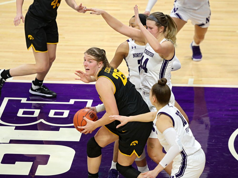 Iowa Hawkeyes forward Monika Czinano (25) looks to pass during the fourth quarter of their game at Welsh-Ryan Arena in Evanston, Ill. on Sunday, January 5, 2020. (Stephen Mally/hawkeyesports.com)