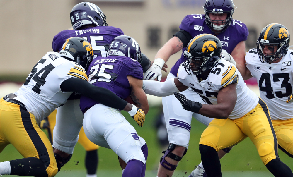 Iowa Hawkeyes defensive tackle Daviyon Nixon (54) and defensive end Chauncey Golston (57) against the Northwestern Wildcats Saturday, October 26, 2019 at Ryan Field in Evanston, Ill. (Brian Ray/hawkeyesports.com)