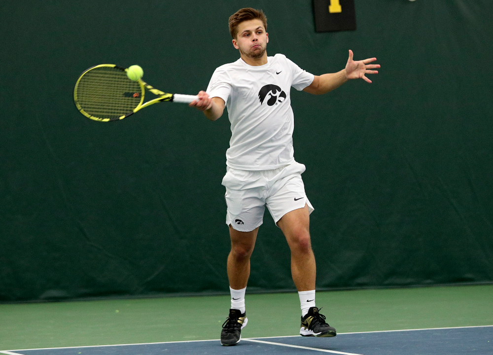 Iowa’s during his doubles match at the Hawkeye Tennis and Recreation Complex in Iowa City on Sunday, February 16, 2020. (Stephen Mally/hawkeyesports.com)
