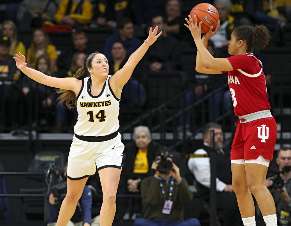 Iowa Hawkeyes guard Mckenna Warnock (14) defends during the first quarter of their game at Carver-Hawkeye Arena in Iowa City on Sunday, January 12, 2020. (Stephen Mally/hawkeyesports.com)