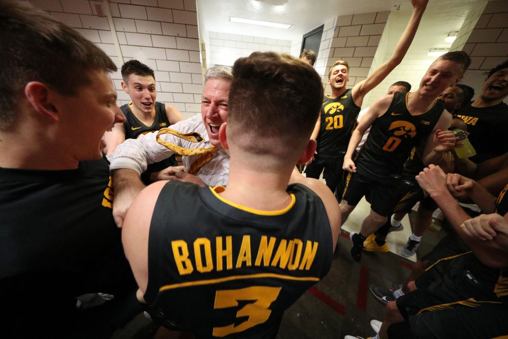 Iowa Hawkeyes assistant coach Kirk Speraw dances with the players as they celebrate their win against the Iowa State Cyclones Thursday, December 12, 2019 at Hilton Coliseum in Ames, Iowa(Brian Ray/hawkeyesports.com)