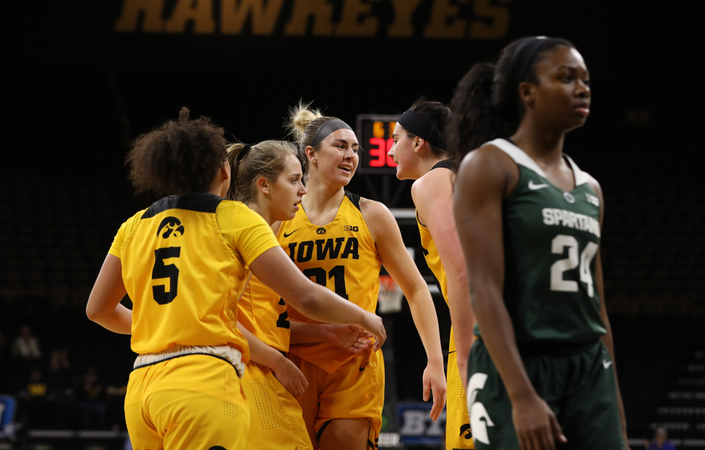 Iowa Hawkeyes guard Alexis Sevillian (5), guard Kathleen Doyle (22), forward Hannah Stewart (21), and forward Megan Gustafson (10) against the Michigan State Spartans Thursday, February 7, 2019 at Carver-Hawkeye Arena. (Brian Ray/hawkeyesports.com)