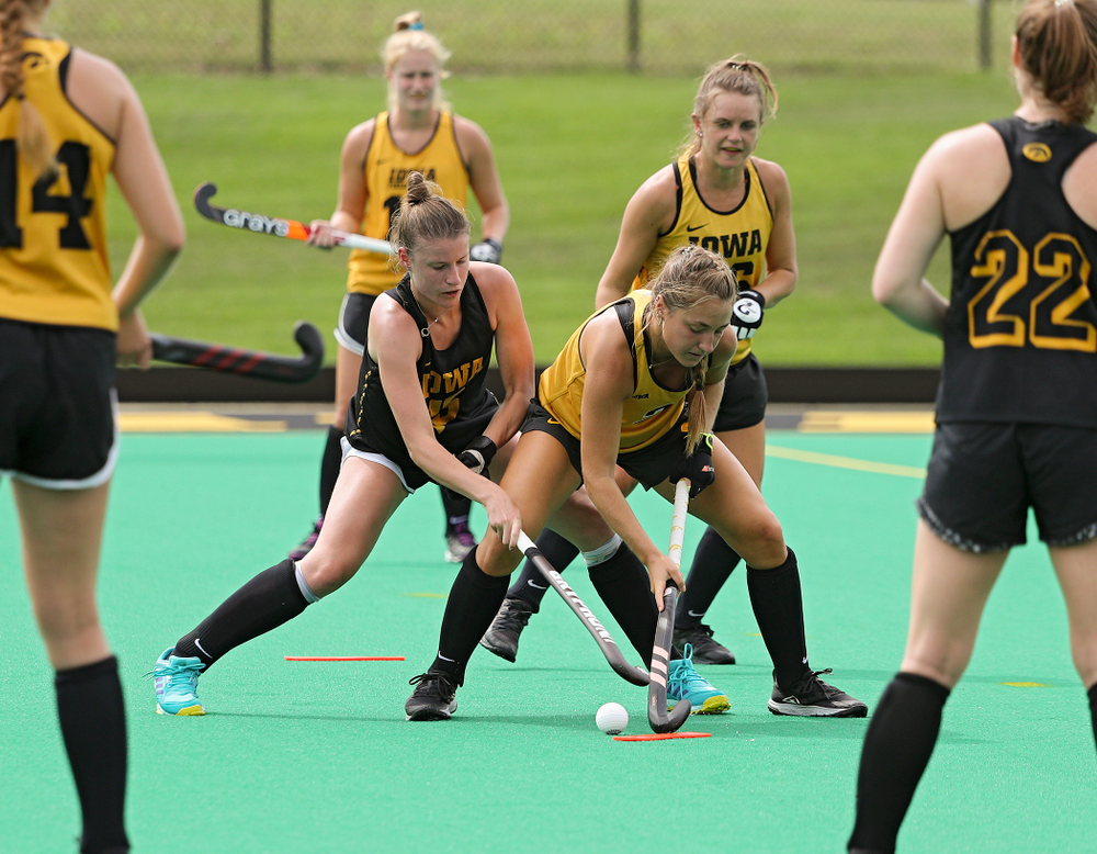 Iowa’s Esme Gibson (15) and Emily Deuell (2) run a drill during practice at Grant Field in Iowa City on Thursday, Aug 15, 2019. (Stephen Mally/hawkeyesports.com)