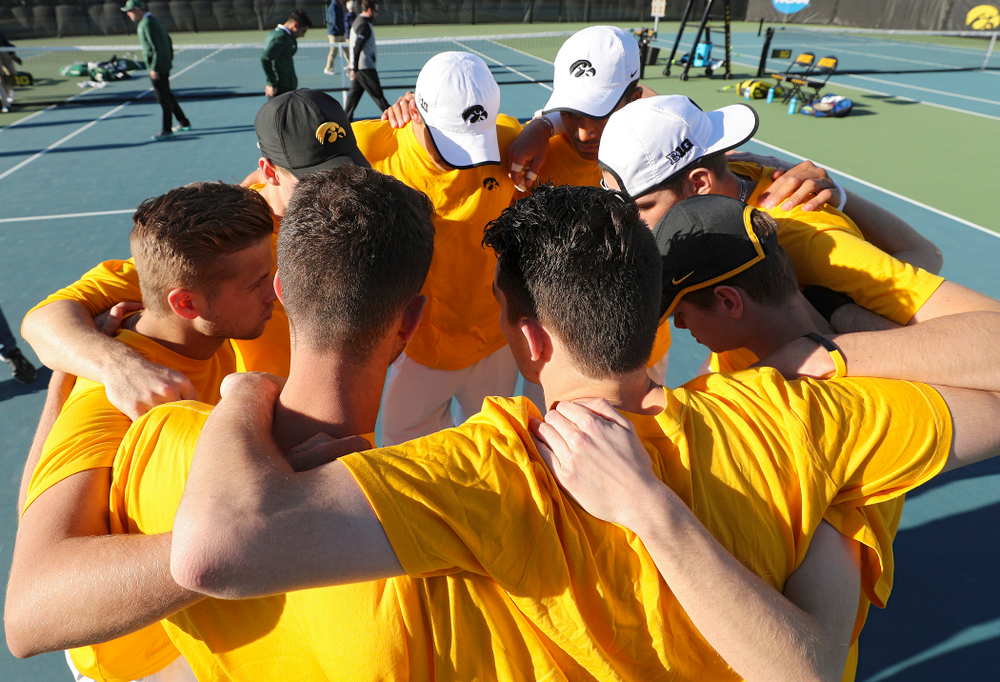 The Iowa Hawkeyes huddle before their match again Michigan State at the Hawkeye Tennis and Recreation Complex in Iowa City on Friday, Apr. 19, 2019. (Stephen Mally/hawkeyesports.com)