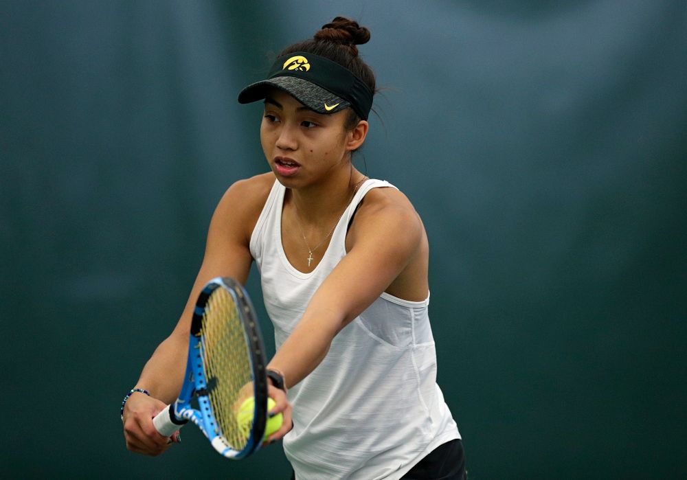 Iowa’s Michelle Bacalla serves during her singles match at the Hawkeye Tennis and Recreation Complex in Iowa City on Sunday, February 23, 2020. (Stephen Mally/hawkeyesports.com)