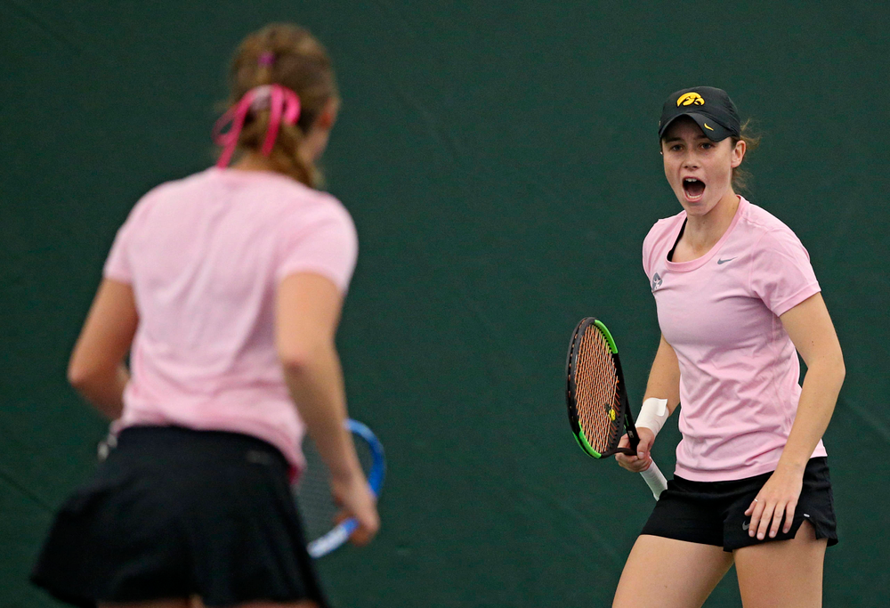 Iowa's Elise van Heuvelen Treadwell (right) and Ashleigh Jacobs celebrates a point during their doubles match against Purdue at the Hawkeye Tennis and Recreation Complex in Iowa City on Friday, Mar. 29, 2019. (Stephen Mally/hawkeyesports.com)
