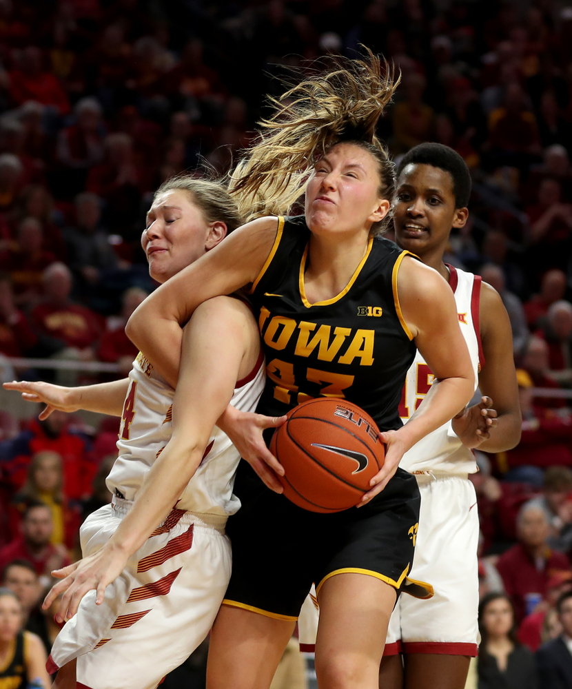 Iowa Hawkeyes forward Amanda Ollinger (43) grabs one of her 20 rebounds against the Iowa State Cyclones Wednesday, December 11, 2019 at Hilton Coliseum in Ames, Iowa(Brian Ray/hawkeyesports.com)