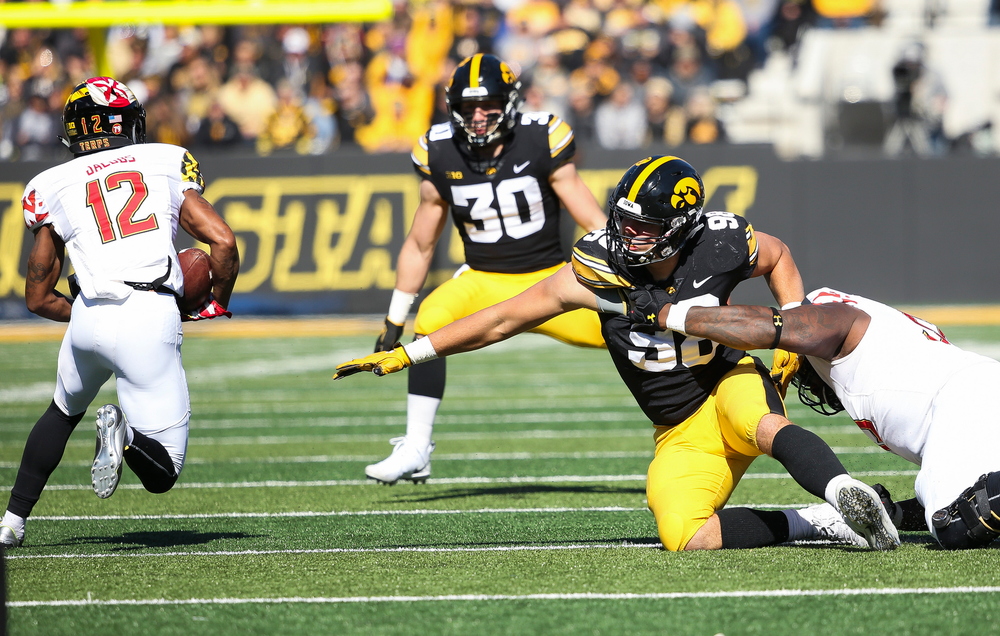 Iowa Hawkeyes defensive end Anthony Nelson (98) is held while trying to make a tackle during a game against Maryland at Kinnick Stadium on October 20, 2018. (Tork Mason/hawkeyesports.com)