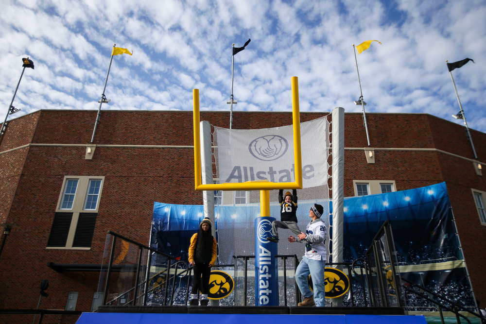 A child plays on a goalpost during Iowa football vs Penn State on Saturday, October 12, 2019 at Kinnick Stadium. (Lily Smith/hawkeyesports.com)
