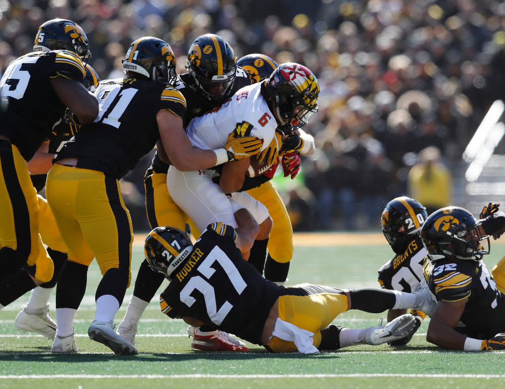 Iowa Hawkeyes defensive end Chauncey Golston (57), defensive lineman Brady Reiff (91), and defensive back Amani Hooker (27) against the Maryland Terrapins Saturday, October 20, 2018 at Kinnick Stadium (Brian Ray/hawkeyesports.com)