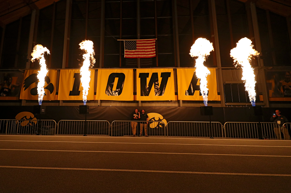 Pyrotechnics are used as the teams are introduced for the women’s 1600 meter relay premier event during the Larry Wieczorek Invitational at the Recreation Building in Iowa City on Saturday, January 18, 2020. (Stephen Mally/hawkeyesports.com)