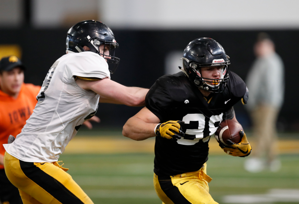 Iowa Hawkeyes tight end T.J. Hockenson (38) and linebacker Nick Niemann (49) Wednesday, April 4, 2018 at the Hansen Football Performance Center. (Brian Ray/hawkeyesports.com)