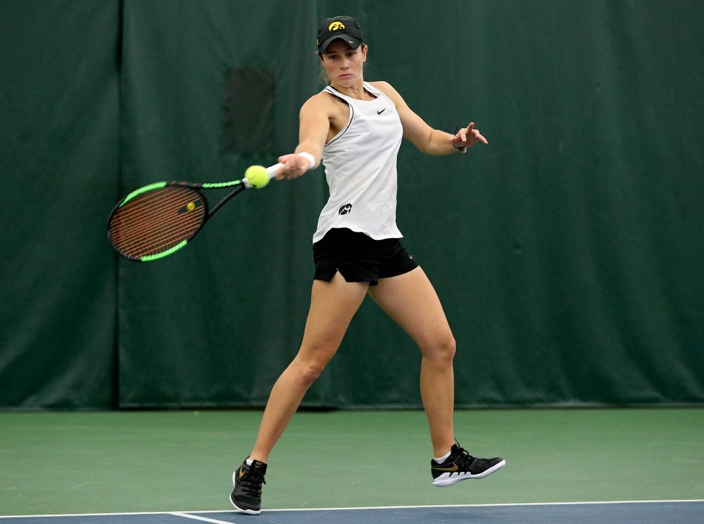 Iowa’s Elise Van Heuvelen returns a shot during her doubles match at the Hawkeye Tennis and Recreation Complex in Iowa City on Sunday, February 16, 2020. (Stephen Mally/hawkeyesports.com)