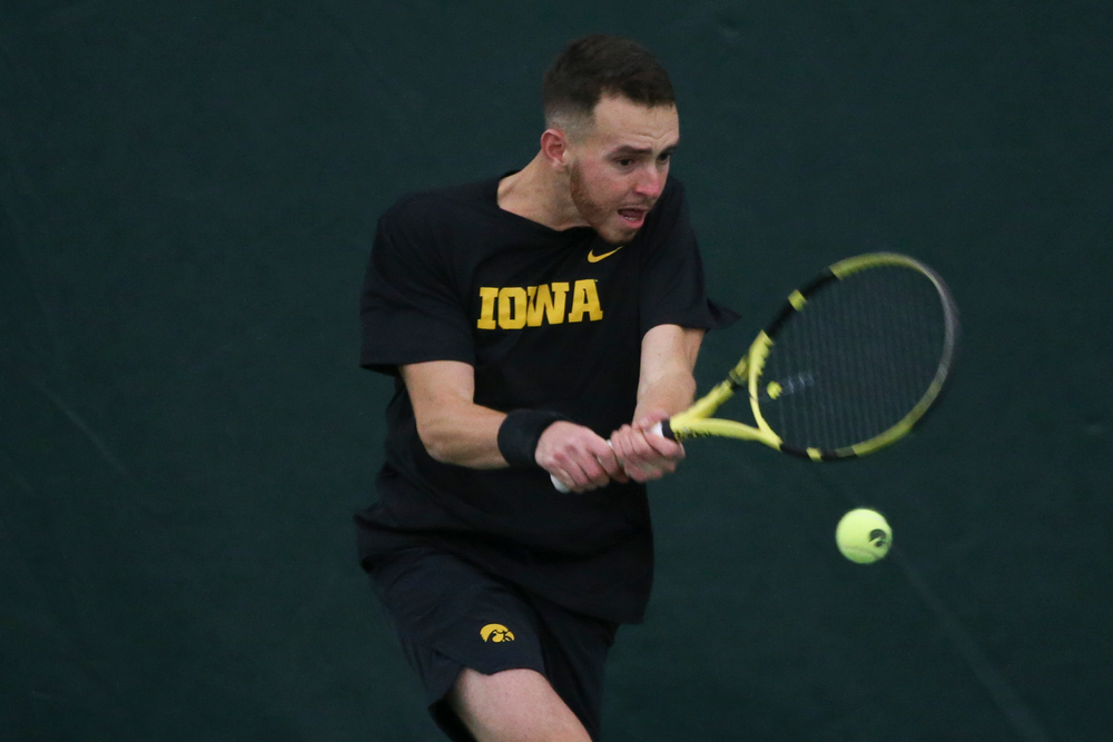 Iowa’s Kareem Allaf returns a hit during the Iowa men’s tennis meet vs VCU on Saturday, February 29, 2020 at the Hawkeye Tennis and Recreation Complex. (Lily Smith/hawkeyesports.com)