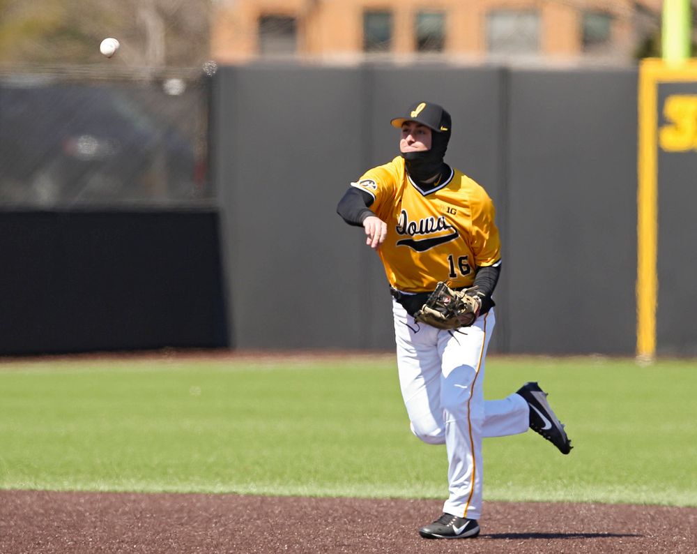 Iowa Hawkeyes shortstop Tanner Wetrich (16) throws to first for an out during the first inning against Illinois at Duane Banks Field in Iowa City on Sunday, Mar. 31, 2019. (Stephen Mally/hawkeyesports.com)
