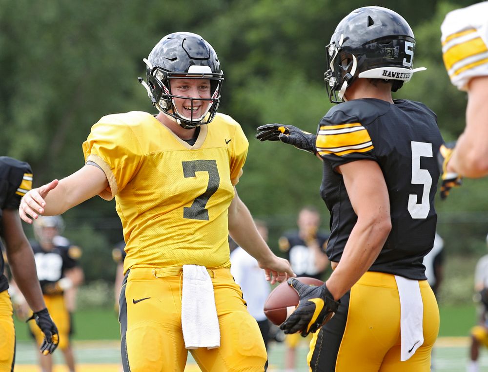 Iowa Hawkeyes quarterback Spencer Petras (7) celebrates with wide receiver Oliver Martin (5) after a touchdown during Fall Camp Practice No. 10 at the Hansen Football Performance Center in Iowa City on Tuesday, Aug 13, 2019. (Stephen Mally/hawkeyesports.com)