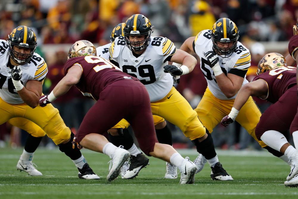Iowa Hawkeyes offensive lineman Dalton Ferguson (76), offensive lineman Keegan Render (69), and Deffensive lineman Ross Reynolds (59) against the Minnesota Golden Gophers Saturday, October 6, 2018 at TCF Bank Stadium. (Brian Ray/hawkeyesports.com)