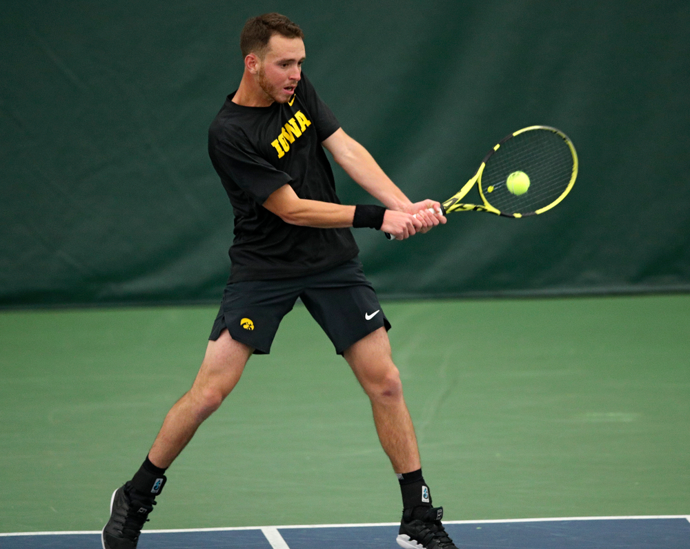 Iowa’s Kareem Allaf returns a shot during their match at the Hawkeye Tennis and Recreation Complex in Iowa City on Thursday, January 16, 2020. (Stephen Mally/hawkeyesports.com)