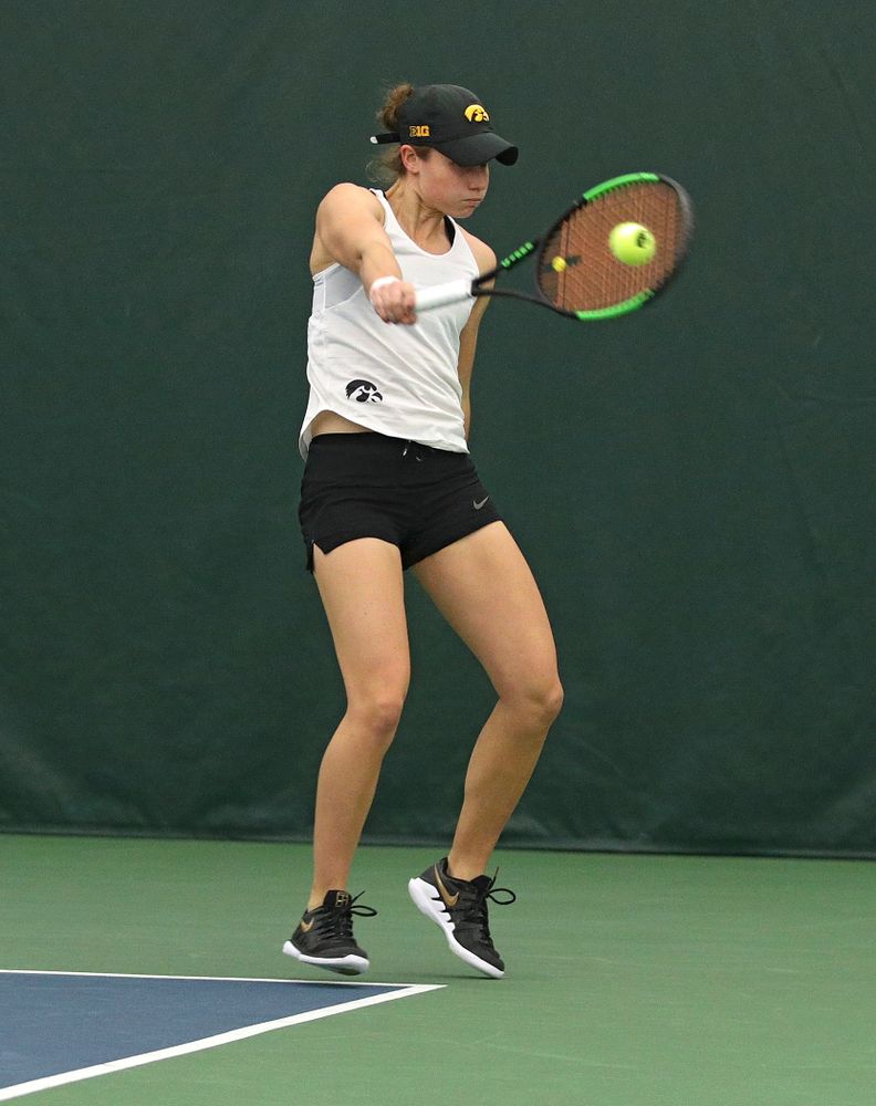 Iowa’s Elise Van Heuvelen returns a shot during her doubles match at the Hawkeye Tennis and Recreation Complex in Iowa City on Sunday, February 23, 2020. (Stephen Mally/hawkeyesports.com)