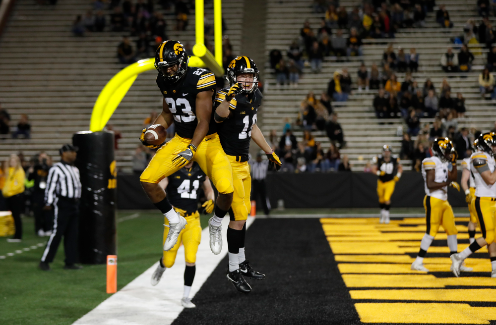 Iowa Hawkeyes wide receiver Dominique Dafney (23) and wide receiver Max Cooper (19) during the final spring practice Friday, April 20, 2018 at Kinnick Stadium. (Brian Ray/hawkeyesports.com)