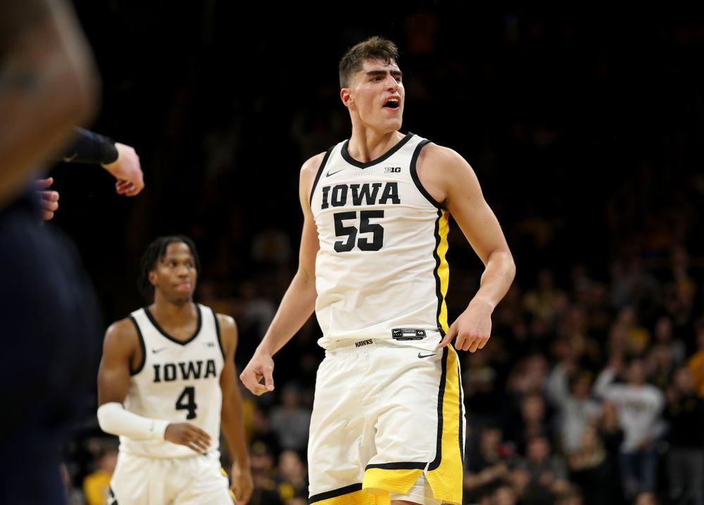 Iowa Hawkeyes forward Luka Garza (55) reacts after making a shot against the Michigan Wolverines Friday, January 17, 2020 at Carver-Hawkeye Arena. (Brian Ray/hawkeyesports.com)
