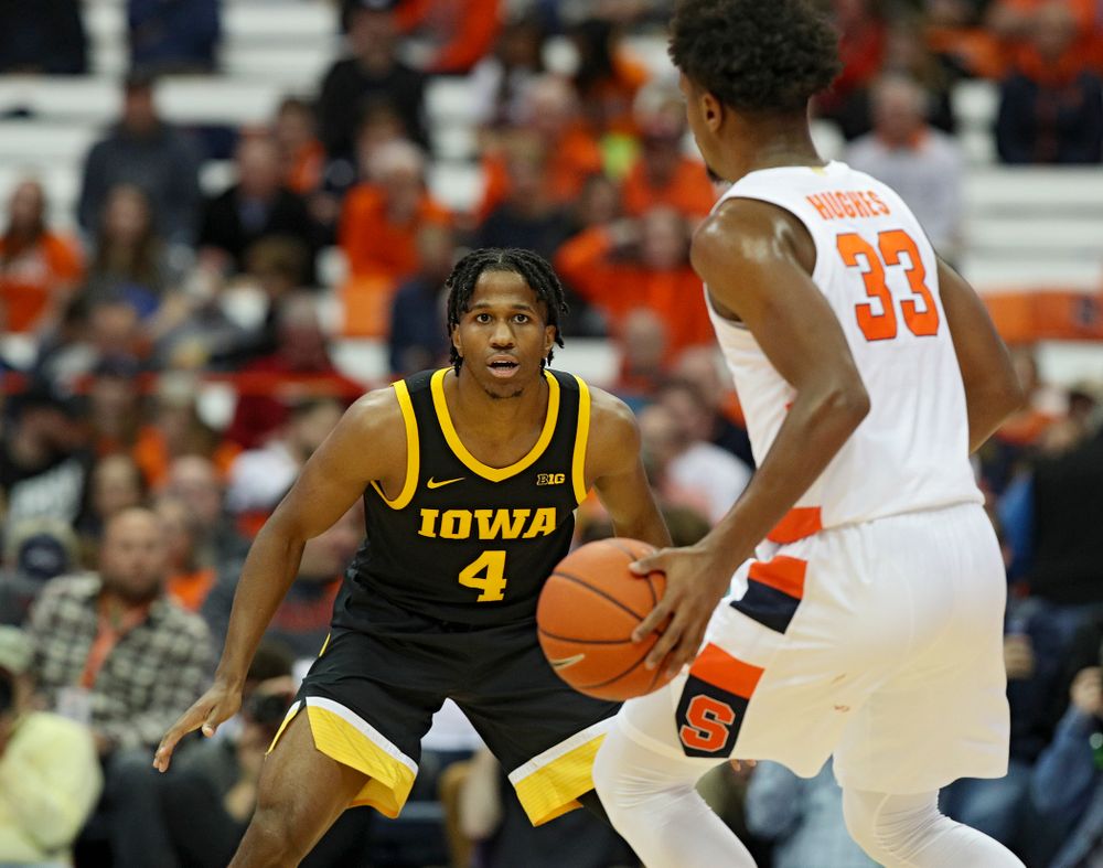 Iowa Hawkeyes guard Bakari Evelyn (4) eyes Syracuse Orange forward Elijah Hughes (33) during the first half of their ACC/Big Ten Challenge game at the Carrier Dome in Syracuse, N.Y. on Tuesday, Dec 3, 2019. (Stephen Mally/hawkeyesports.com)